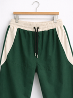 Pantalón Baggy Bicolor Tela Nova — Verde Botella / Crema | ENKI - ENKI ModaStyle