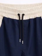 Pantalón Baggy Bicolor Tela Nova — Azul Marino / Crema | ENKI - ENKI ModaStyle