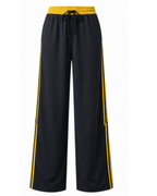 Pantalón Deportivo Oversized Negro con Franjas Amarillas — Tela Nova | Mujer | ENKI - ENKI ModaStyle