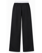 Pantalón Deportivo Oversized Negro con Franjas Blancas — Tela Nova | Mujer | ENKI - ENKI ModaStyle
