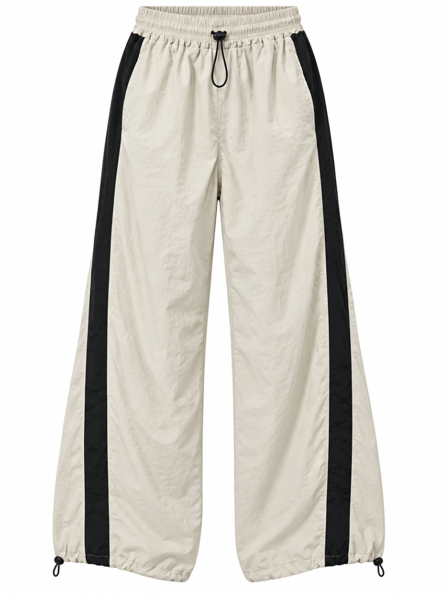 Pantalón Aura Oversized para mujer en tela mojada color hueso con franjas negras laterales