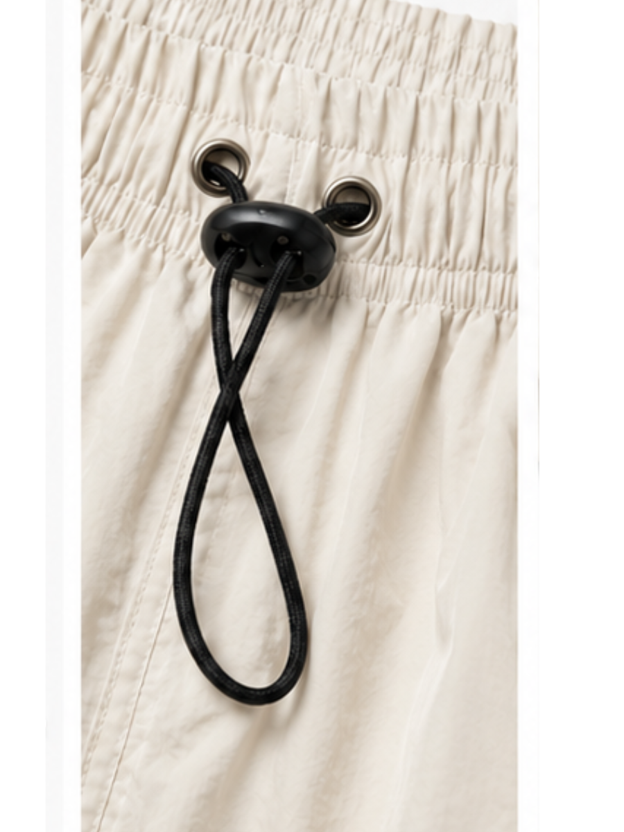 Pantalón Power Track Hueso — Tela Mojada | Mujer | ENKI - ENKI ModaStyle