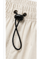 Pantalón Power Track Hueso — Tela Mojada | Mujer | ENKI - ENKI ModaStyle
