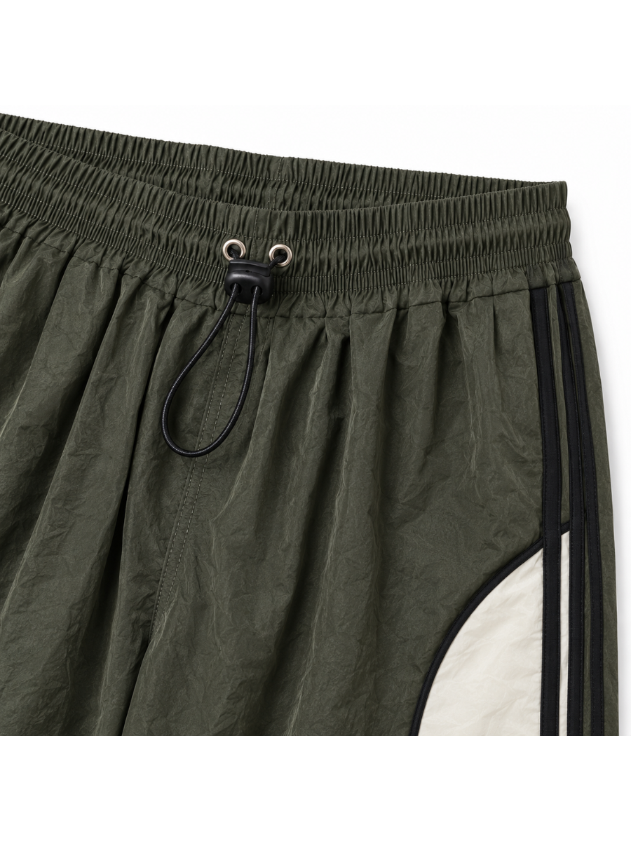 Pantalón Power Track Verde Militar — Tela Mojada | Mujer | ENKI - ENKI ModaStyle